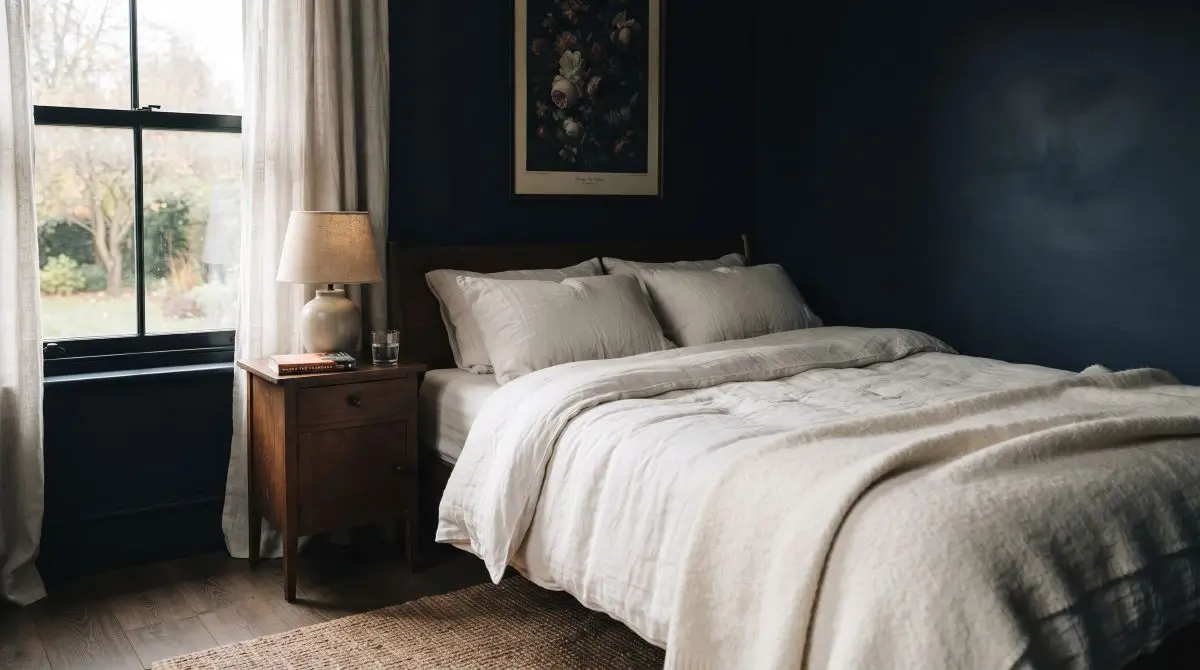 Light Bedding Against Dark Walls
