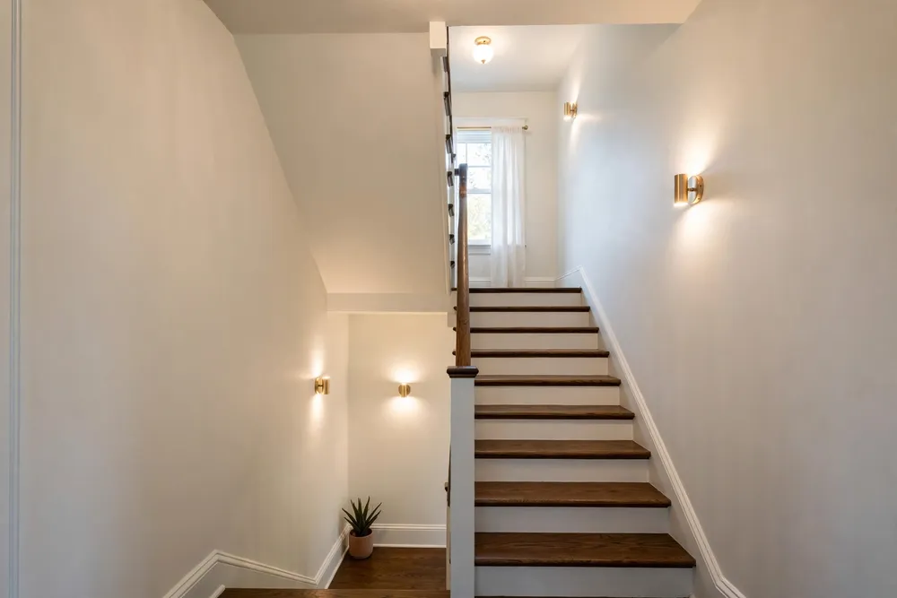 Light paint scheme brightening a dim stairwell staircase wall decor